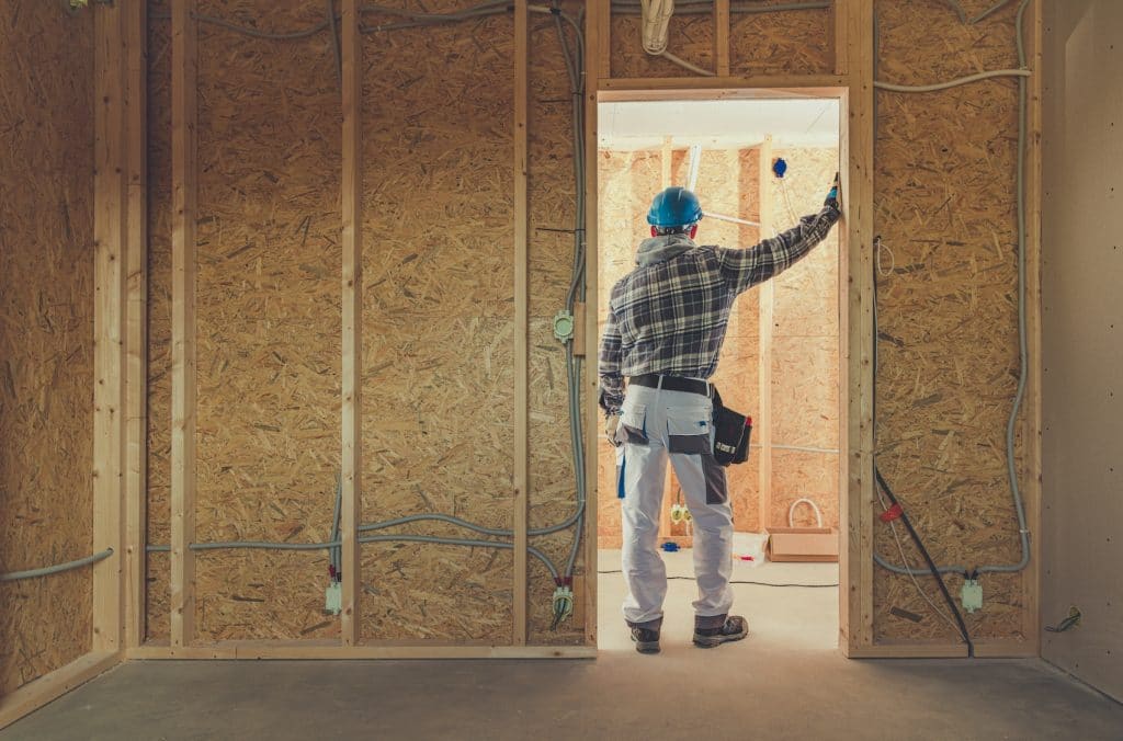 electrician standing in a home construction site