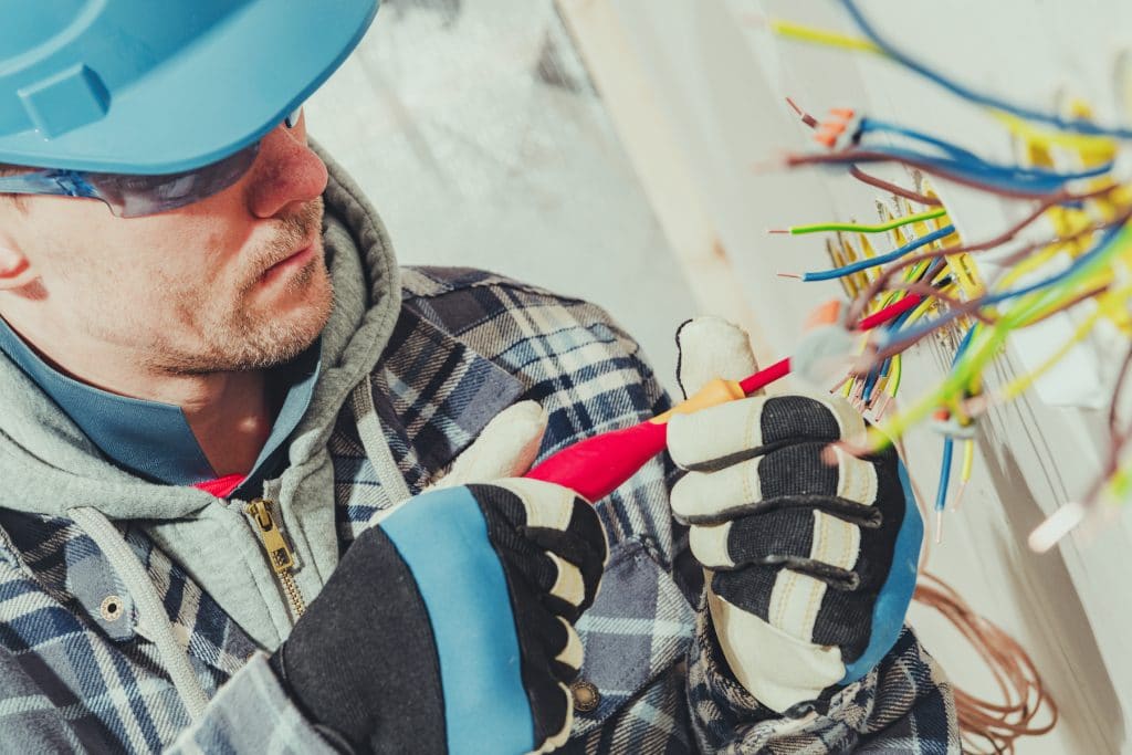 electrician installing outlets