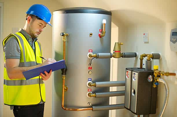 worker is checking the Water Heater tank