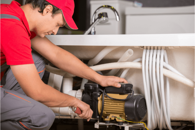 Professional plumbing services in Cleveland Heights fixing the bathroom's sink.