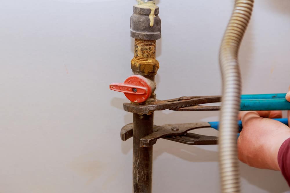 Professional plumber fixing gas line issues.