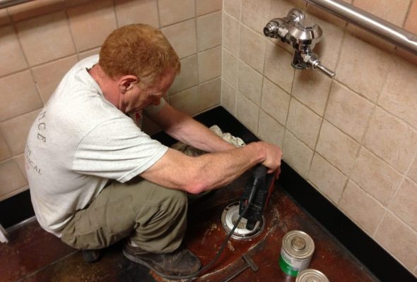 plumber working on residential drains
