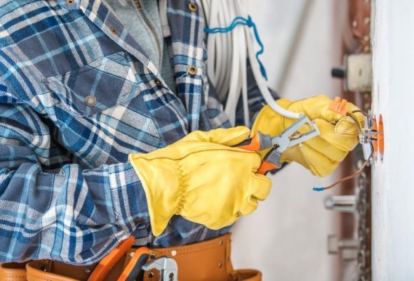 Professional Electrician Installing Light